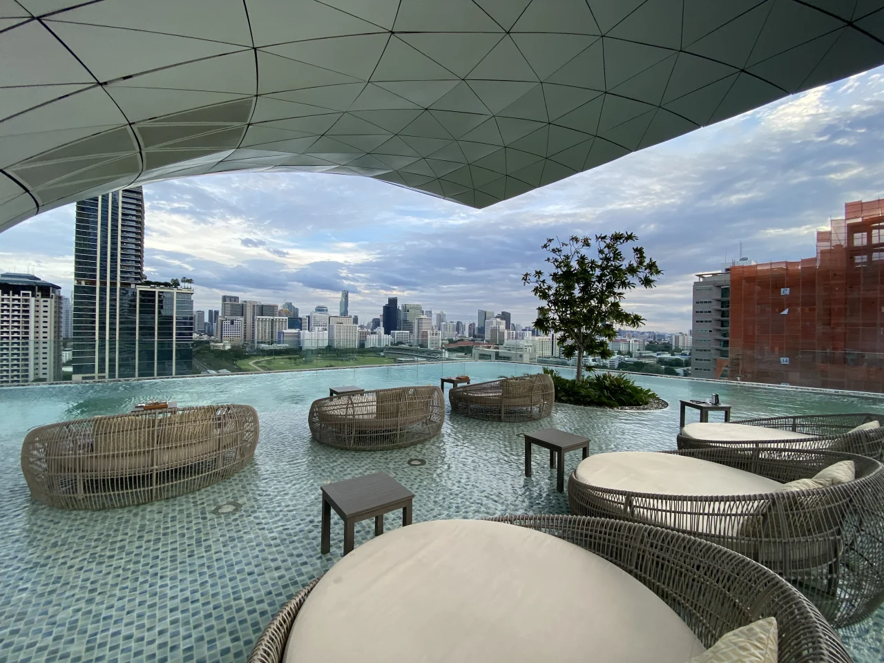 Marble bathroom with a bathtub and double vanity at Waldorf Astoria Bangkok