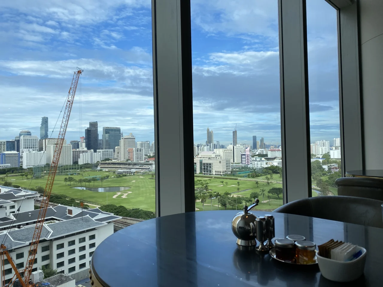 Room view over the Royal Bangkok Sports Club golf course and the city skyline