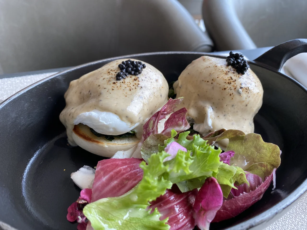 Truffle-scented Eggs Benedict topped with caviar at Waldorf Astoria Bangkok breakfast